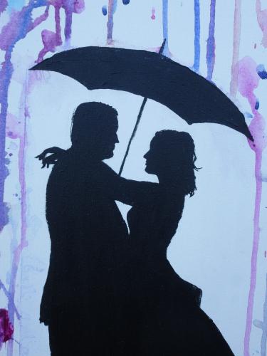 silhouetted couple holding umbrella